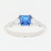 Princess blue moissanite sterling silver ring with sparkling moissanite accents.